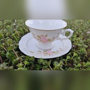 Elegant White Porcelain Teacup and Saucer with Pink Floral Design